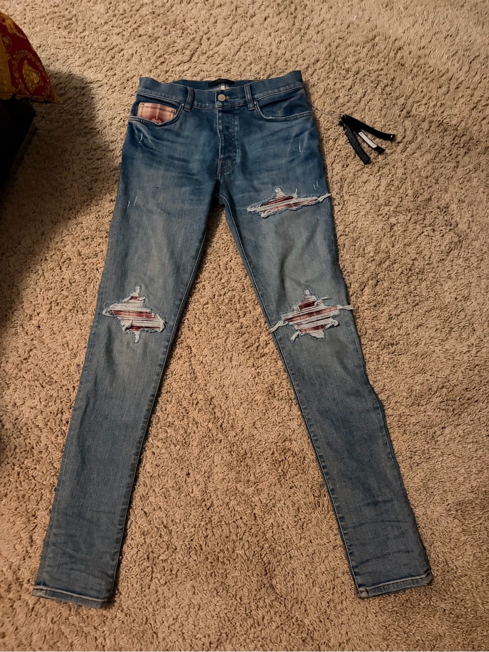 AMIRI Distressed Blue Skinny Jeans with Red Patch Details